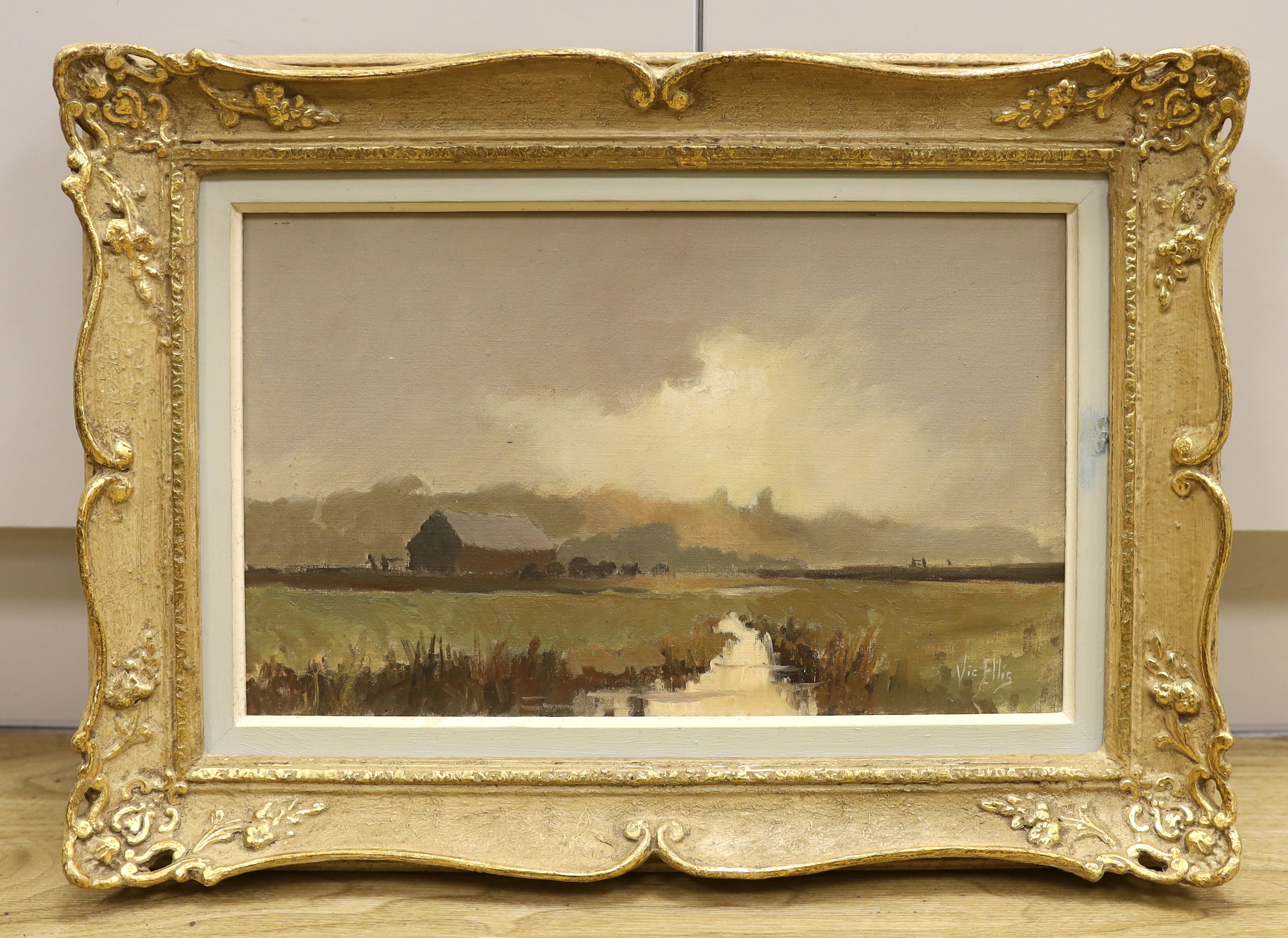 Vic Ellis (1921-1984) oil on canvas, landscape with farm buildings, signed, 24 x 39cm, ornate gilt frame